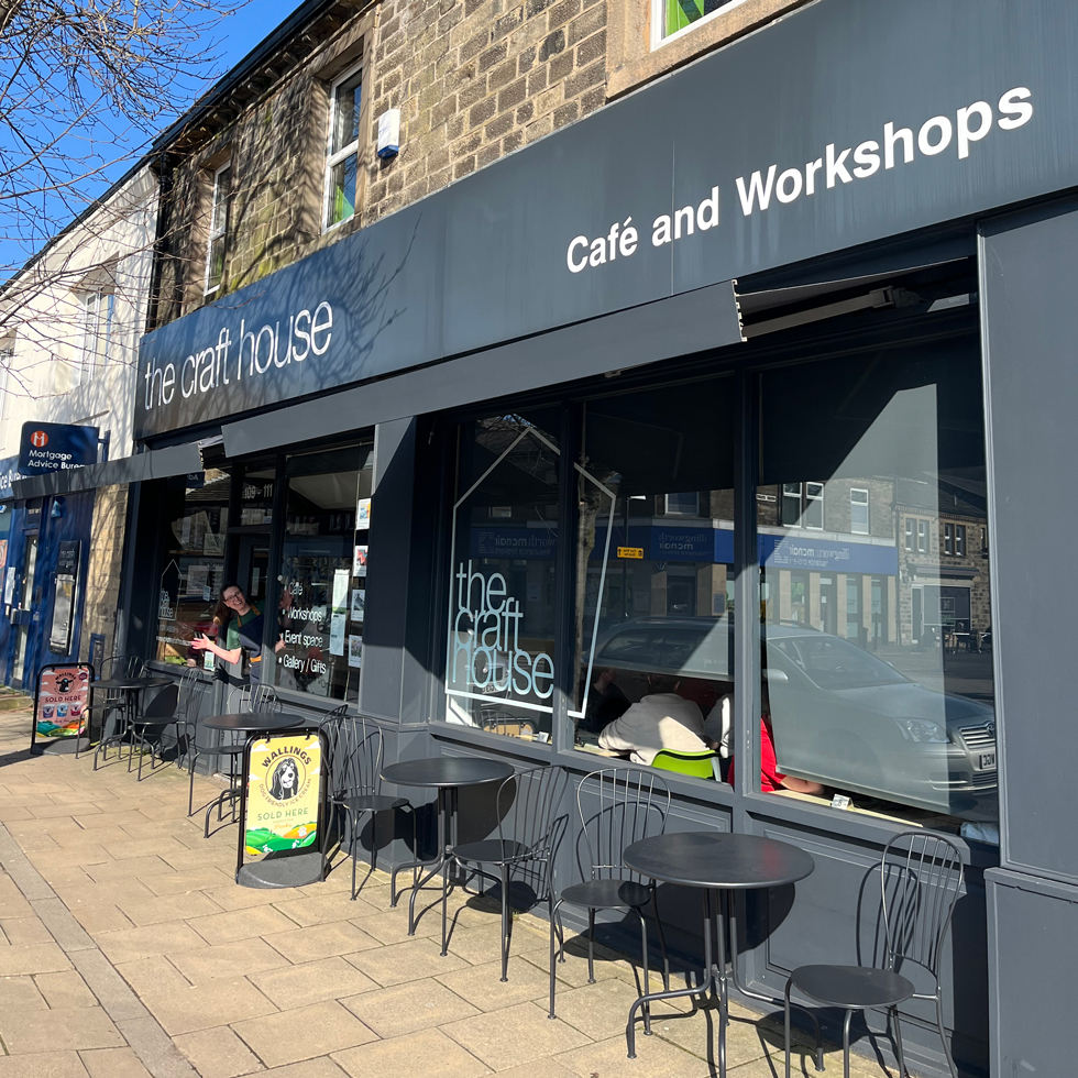Front of Craft House Cafe building with chairs and tables outside